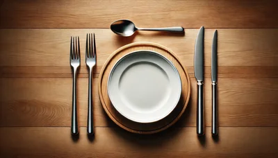 Elegant Table Setting With Silverware And Empty Plate