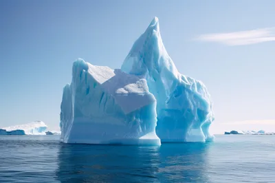 Large Blue Iceberg Floating In Arctic Ocean