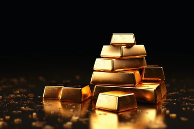 Stack of Shiny Gold Bars on Reflective Surface