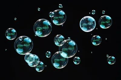 Floating Transparent Soap Bubbles On Black Background