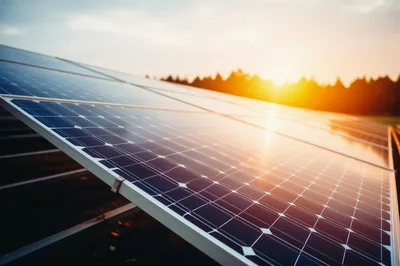 Solar Panels Generating Renewable Energy At Sunset