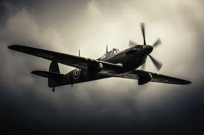 Vintage Supermarine Spitfire Fighter Plane Flying Through Stormy Clouds