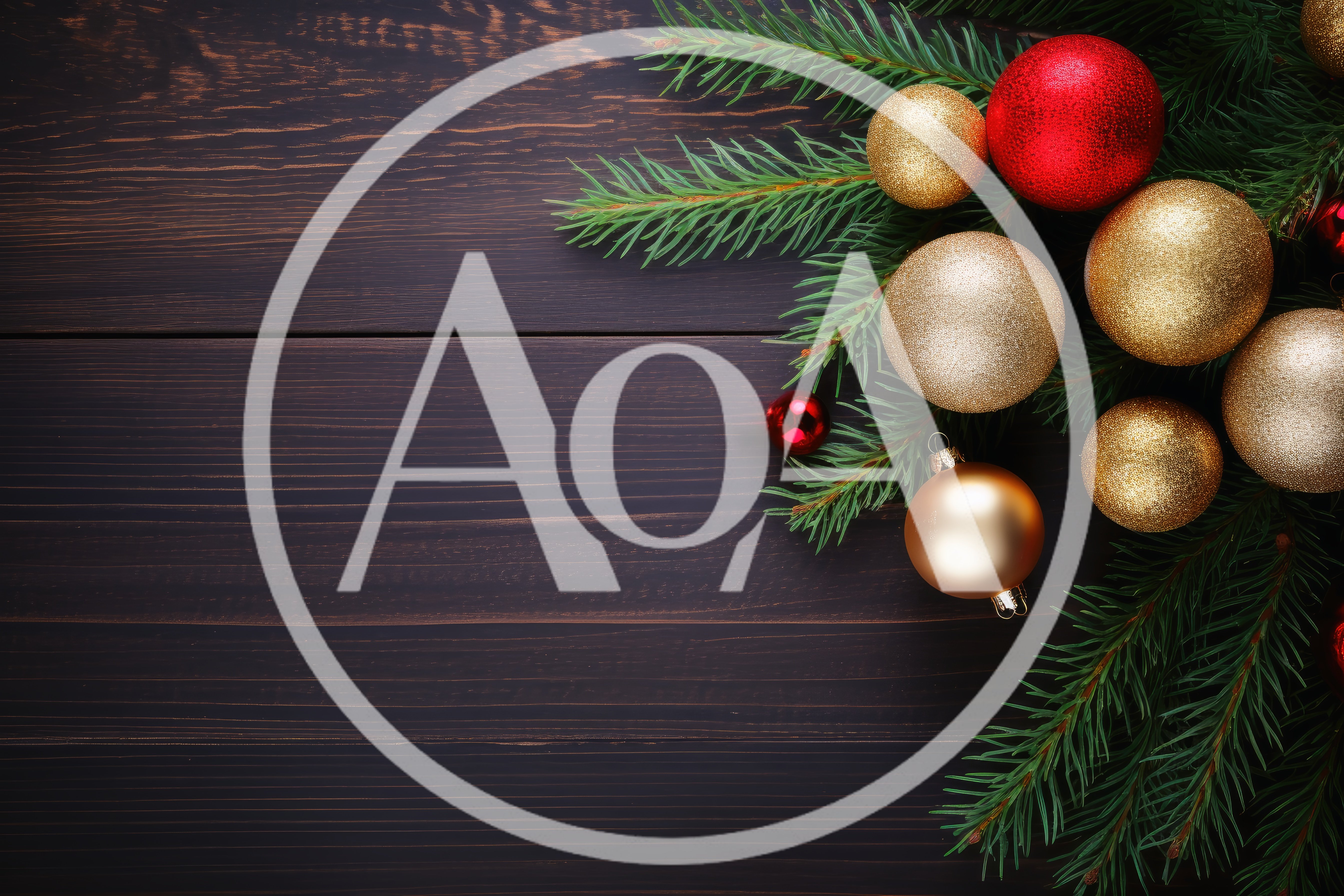 Christmas Ornaments and Pine Branches on Dark Wood