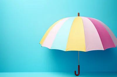 Colorful Pastel Umbrella Against A Bright Blue Background