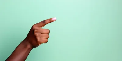 Dark Skinned Hand Pointing To The Right