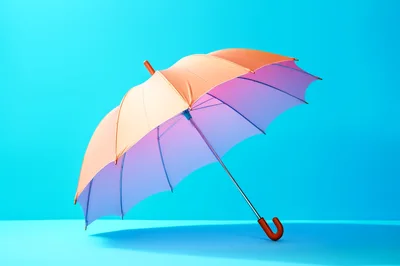 Gradient Umbrella Against A Bright Blue Background