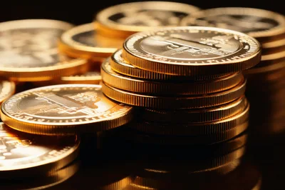 Stack Of Golden Cryptocurrency Coins On Dark Surface