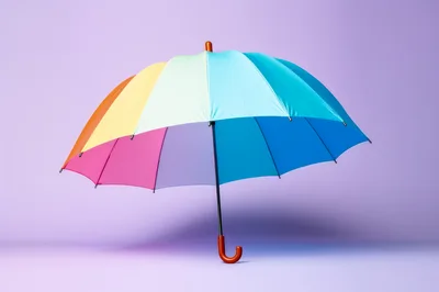 Colorful Rainbow Umbrella Against A Solid Purple Background
