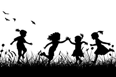 Silhouettes Of Children Playing In A Grassy Meadow