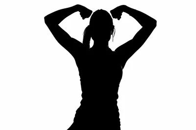 Silhouette Of A Woman Flexing Her Arm Muscles