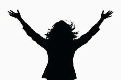 Silhouette of a Woman Celebrating with Arms Raised