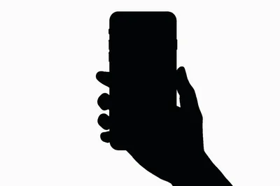 Silhouette Of A Hand Holding A Smartphone