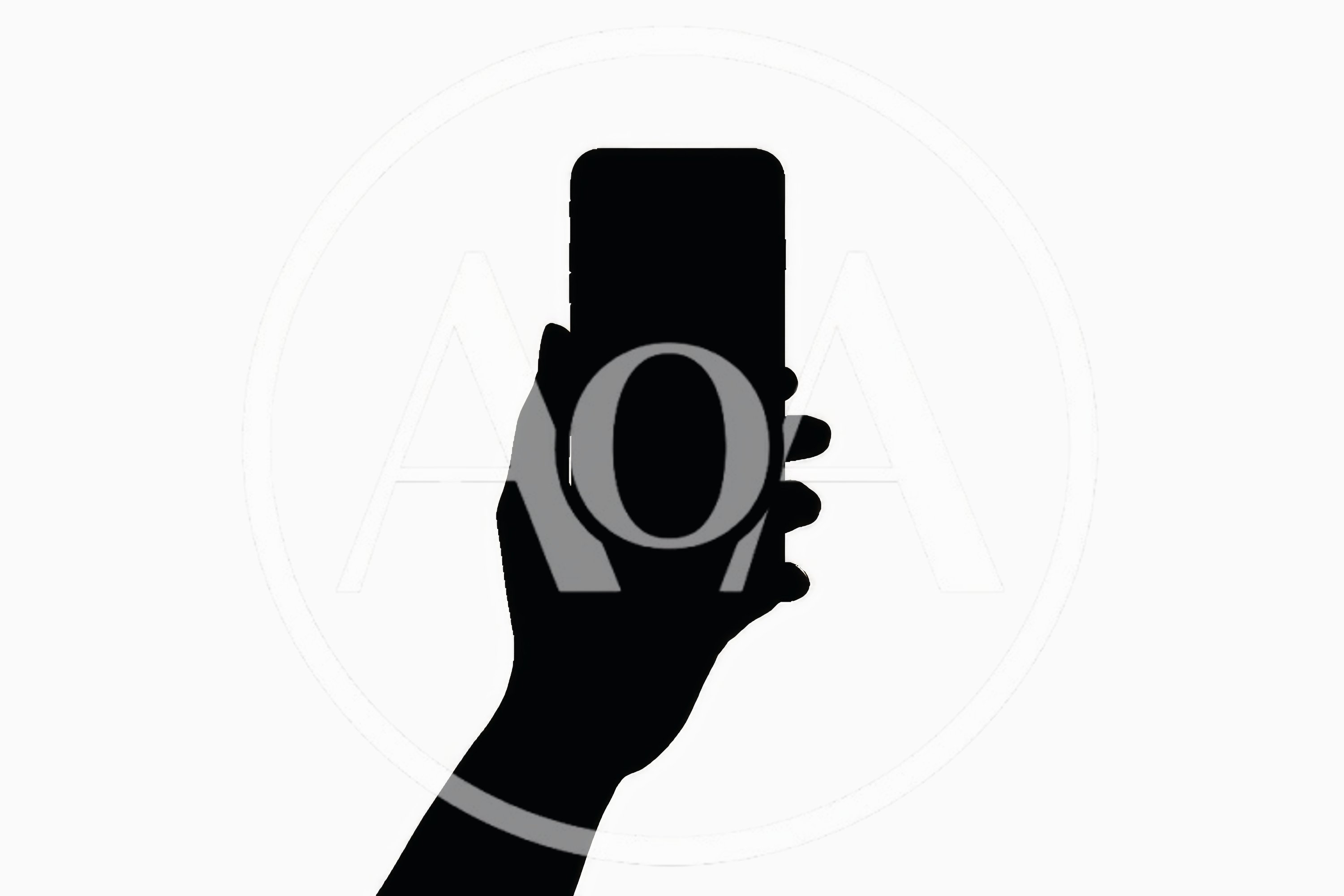 Silhouette Of A Hand Holding A Smartphone