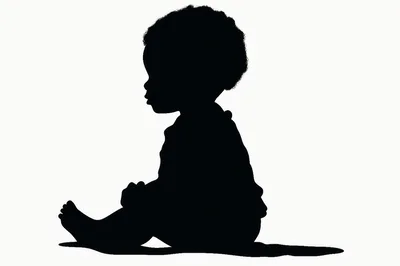 Silhouette Of A Toddler Sitting On The Floor