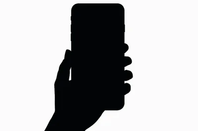 Silhouette Of A Hand Holding A Smartphone