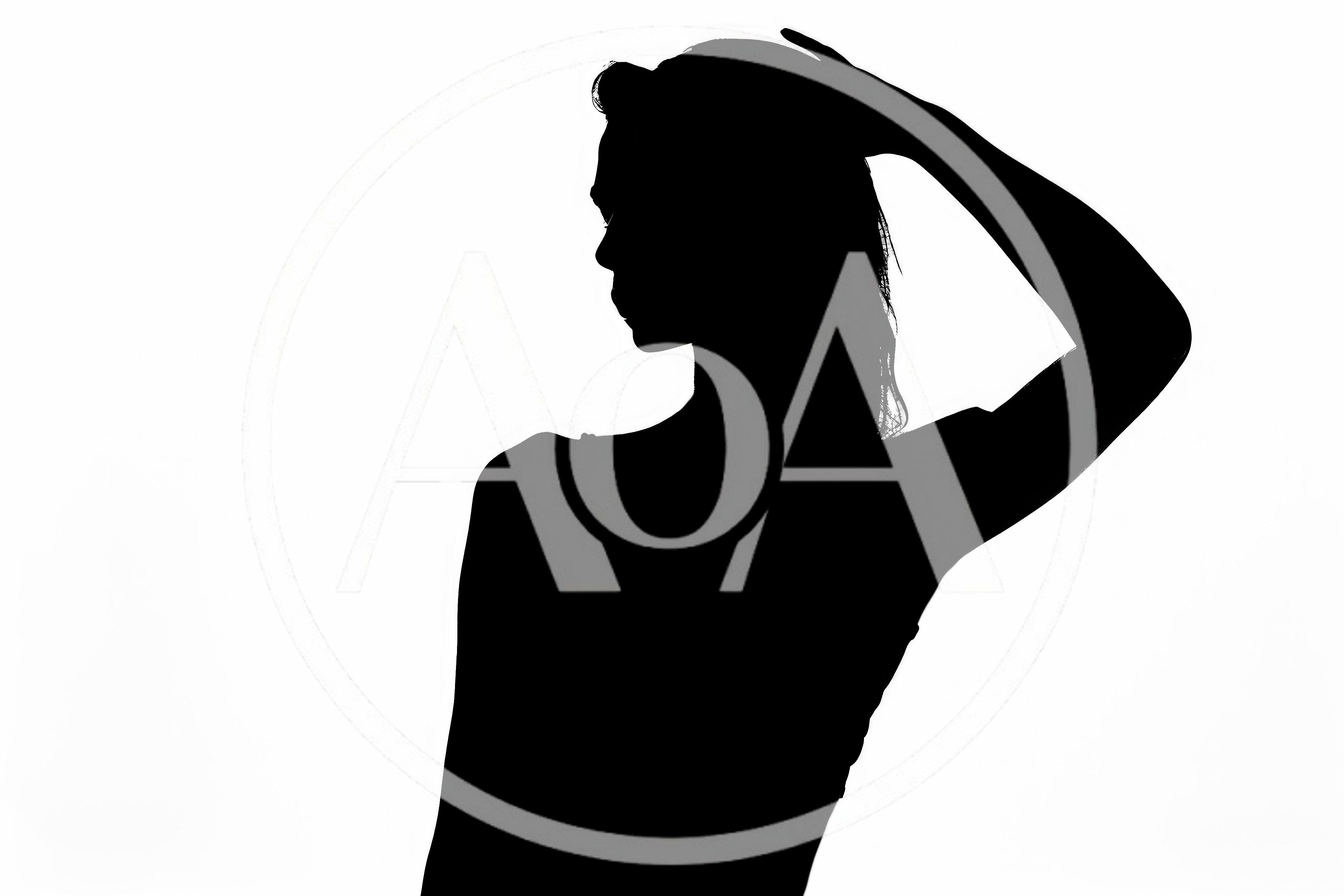 Silhouette of a Woman Posing Against White Background