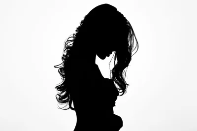 Silhouette Of A Woman With Long Wavy Hair