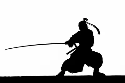 Silhouette Of A Samurai Warrior Drawing A Katana