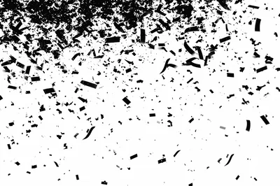 Black Confetti Falling Against A White Background
