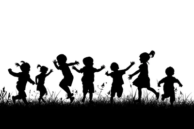 Silhouettes Of Happy Children Playing In A Field