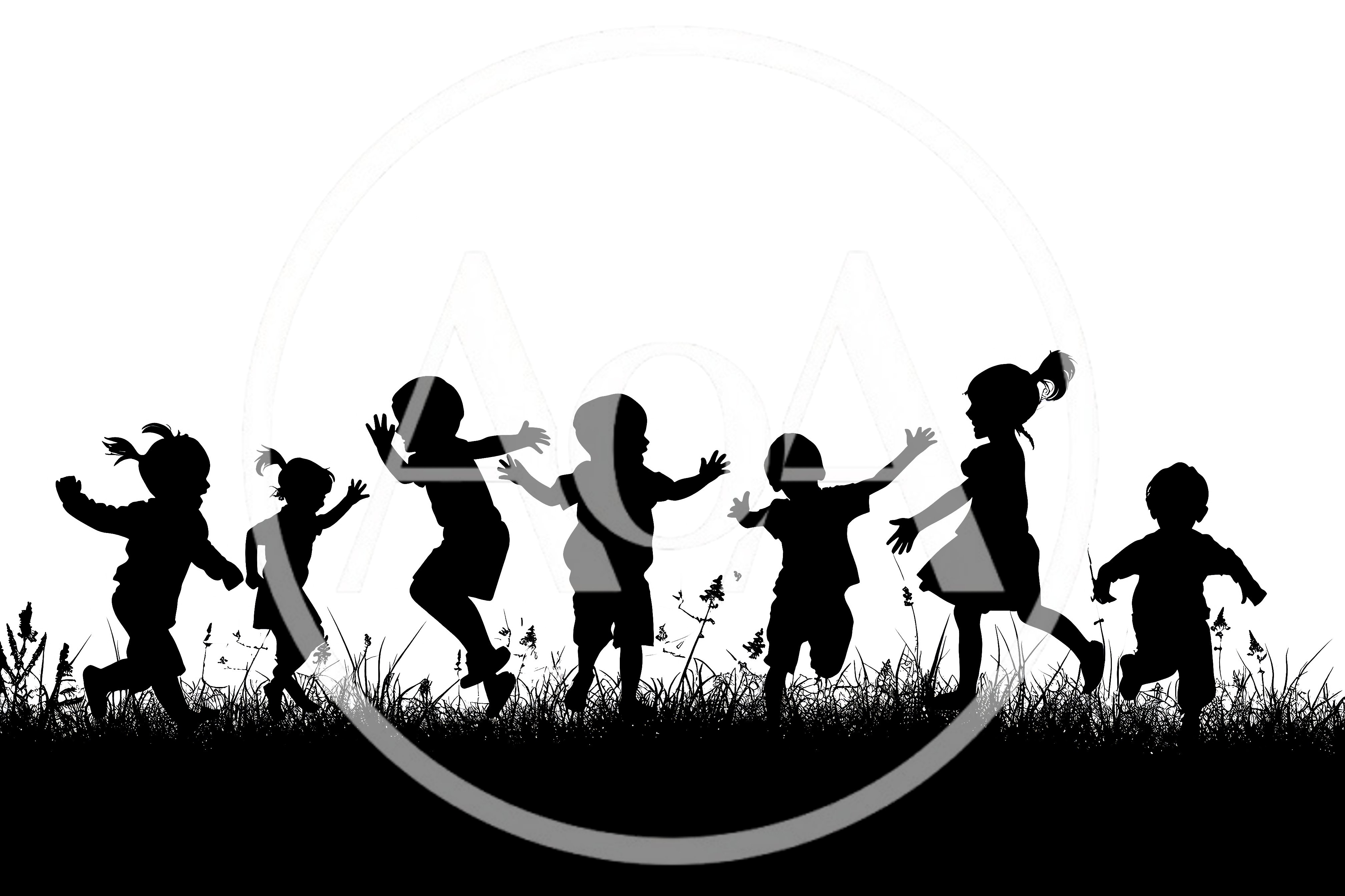 Silhouettes Of Happy Children Playing In A Field