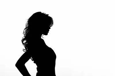 Silhouette Of A Woman With Long Wavy Hair