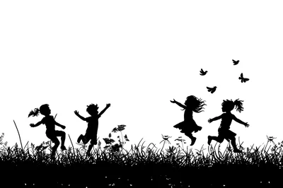 Silhouettes of Happy Children Playing in a Meadow