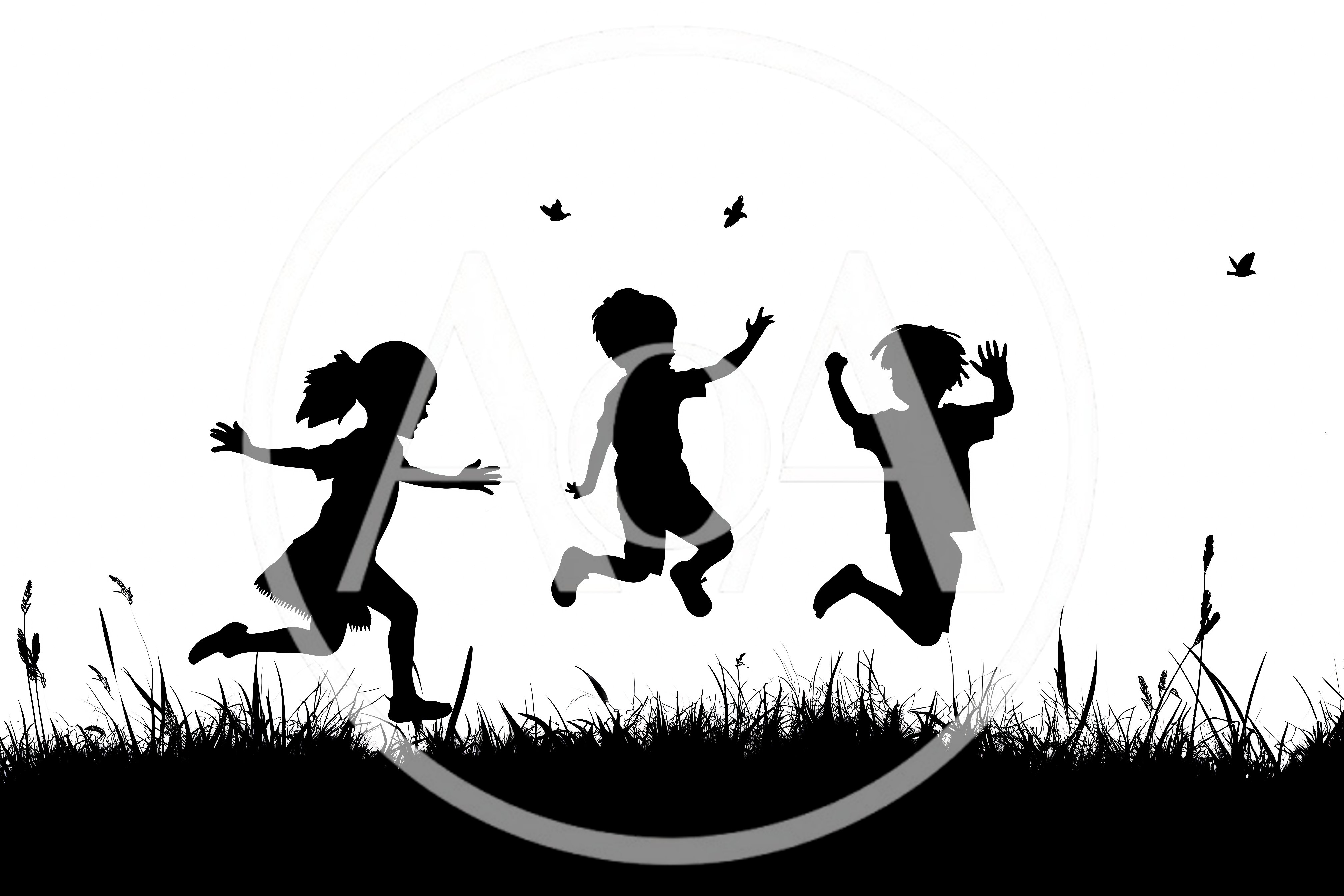 Silhouettes of Children Playing and Jumping in Grass