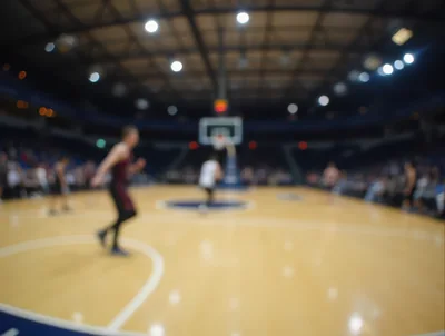 Blurred Basketball Players In A Professional Indoor Arena