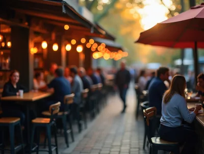 People Dining At Outdoor Restaurant Patio At Sunset