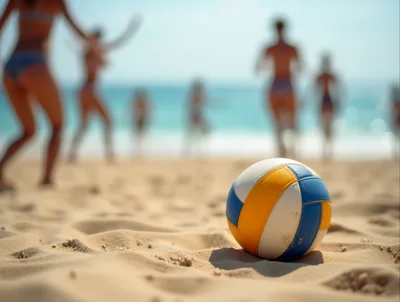 Volleyball Resting On Sandy Beach With Players In Background