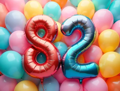 Number 82 Foil Balloons Against Colorful Balloon Background