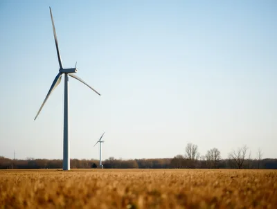Wind Turbines Standing In A Harvested Agricultural Field