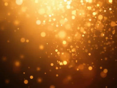 Golden Bokeh Light Particles Floating In Dark Background