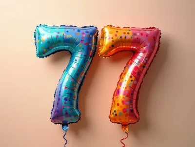 Two Number Seven Balloons On A Beige Background