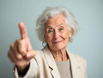 Senior Woman Pointing Finger At Camera