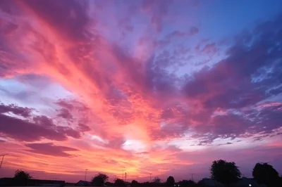 Vibrant Sunset Sky With Dramatic Pink And Purple Clouds