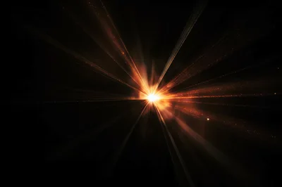 Abstract Golden Light Burst With Radiant Particles