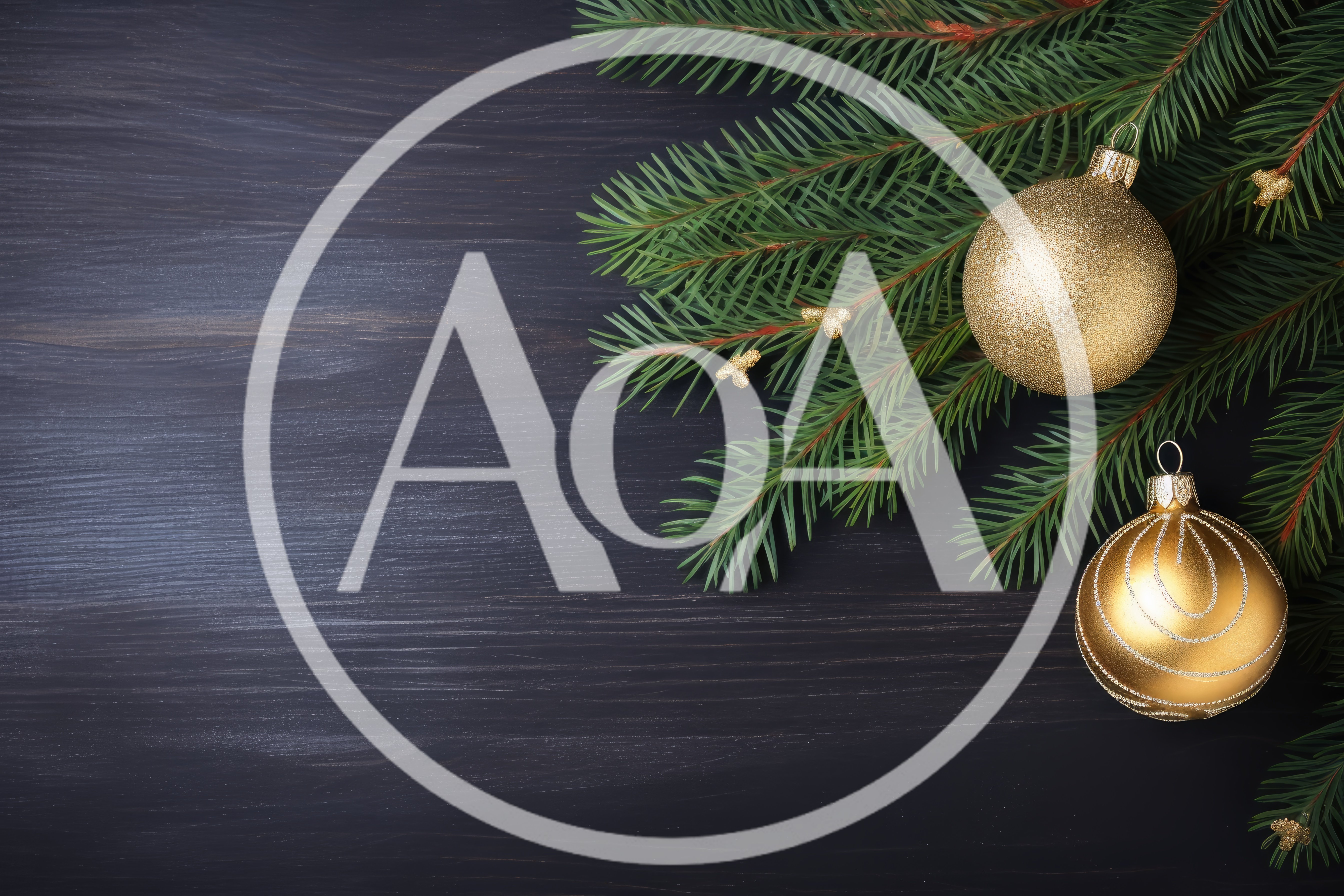 Christmas Ornaments and Pine Branches on Dark Wood