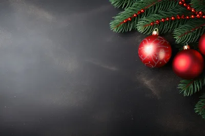 Christmas Ornaments And Pine Branches On Black Background