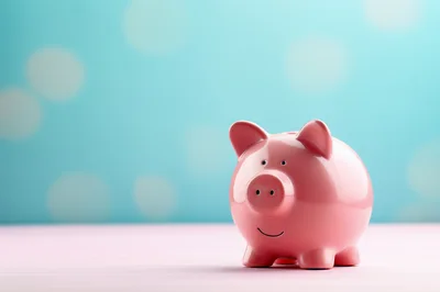 Pink Piggy Bank on Pastel Surface