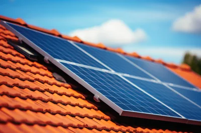 Solar Panels Installed On Red Tiled Roof