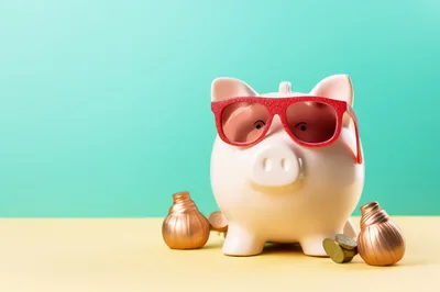 Piggy Bank Wearing Red Sunglasses With Gold Coins