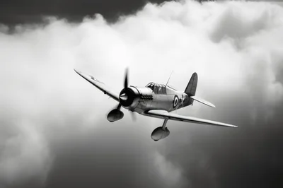Vintage World War II Fighter Plane Flying Through Clouds