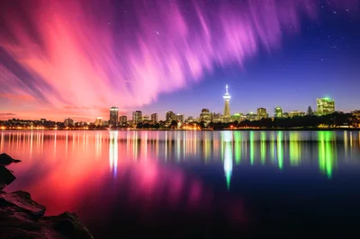 Stunning Night Skyline Reflection Over Calm Lake