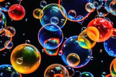 Colorful Soap Bubbles Floating Against Black Background