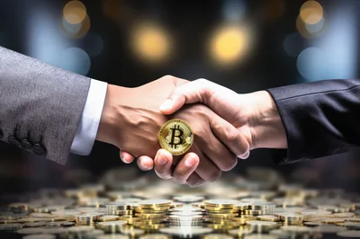 Business Handshake Holding A Golden Bitcoin Coin