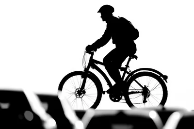 Silhouette Of A Cyclist Riding A Mountain Bike