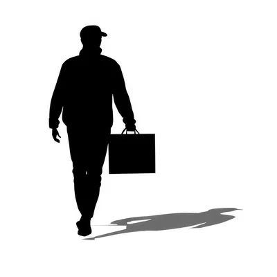 Silhouette Of A Man Walking With A Shopping Bag