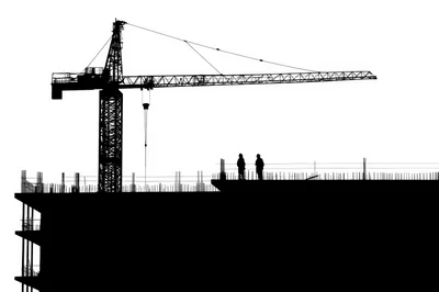 Construction Site Silhouette With Crane And Workers